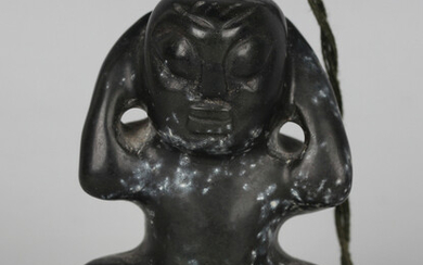 A pre-Columbian Mayan style carved black hardstone figure of a squatting male, length 6cm. Provenanc