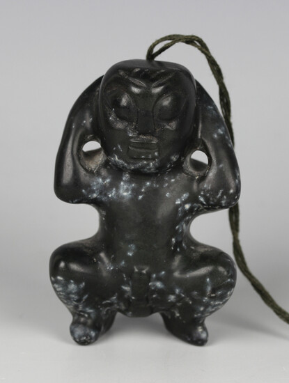 A pre-Columbian Mayan style carved black hardstone figure of a squatting male, length 6cm. Provenanc