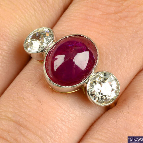 A ruby cabochon and old-cut diamond three-stone ring.