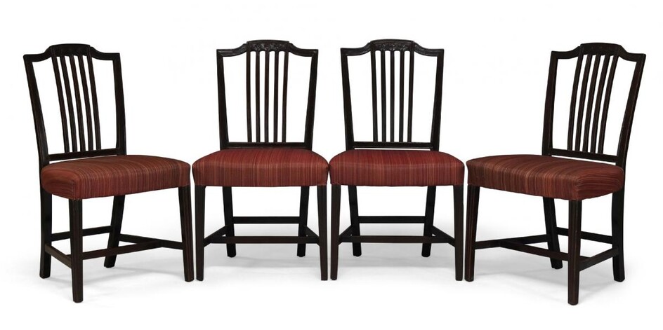 A set of four George III mahogany dining chairs, the...