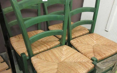 A set of four green painted wooden chairs with seagrass...