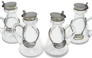 A set of four silver mounted whisky noggins, Birmingham, 1923, Cornelius Desormeaux Saunders & James Francis Hollings Shepherd, of conventional conical glass form with star cut bases, the silver collars to hinged lids with shell thumbpieces, 10cm...