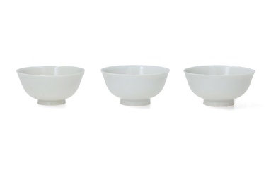 A set of three white porcelain miniature cups. Unmarked. China, 18th century. H. 2.5 cm.