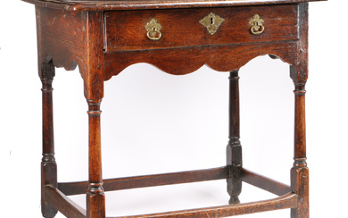 A small George I oak side table, circa 1720 The top of two boards with ovolo-moulded edge, single