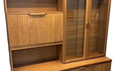 A teak mid century wall unit, with pair of glazed...