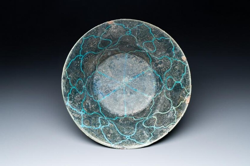 A turquoise- and black-glazed bowl, Kashan, Iran, 12/13th C.