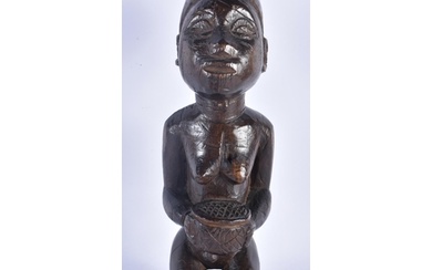 AN AFRICAN TRIBAL CARVED WOOD FERTILITY FIGURE. 28 cm high.