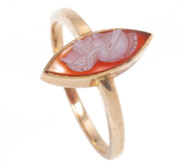 AN ANTIQUE 18CT GOLD HARDSTONE CAMEO RING; set with a carved sardonyx cameo of a centurion, size N, wt. 2.47g.