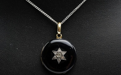 AN ANTIQUE BLACK ENAMEL AND DIAMOND MOURNING PENDANT WITH INTERNAL HAIR FEATURE, ENGRAVED.