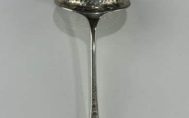 AN ANTIQUE FRENCH STERLING SILVER TEA STRAINER