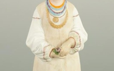 AN EARLY 20TH CENTURY RUSSIAN STANDING BISQUE FIGURE OF