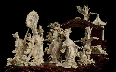 AN IVORY AND WOOD GROUP WITH FEMALE FIGURES China