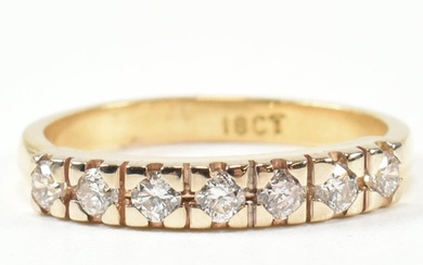 An 18ct gold and diamond half hoop ring. The gold ring set w...
