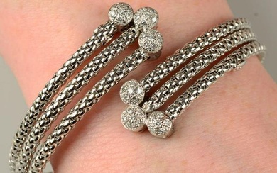 An 18ct gold brilliant-cut diamond terminal crossover cuff bangle, by Fope.Estimated total diamond