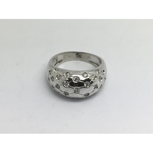 An 18ct white gold stone set band ring, approx 10g and appro...