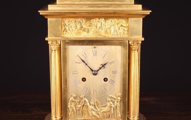 An Elkington Gilt Metal Mantel Clock. The silvered face signed ELKINGTON within a ring of black Roma