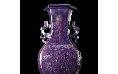 An aubergine glazed vase with relief decoration China, 20th century (h. 36.6 cm.)