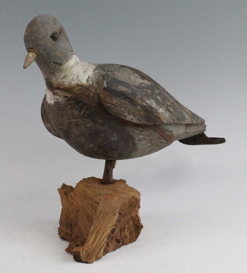 An early 20th century carved and painted pine decoy,...