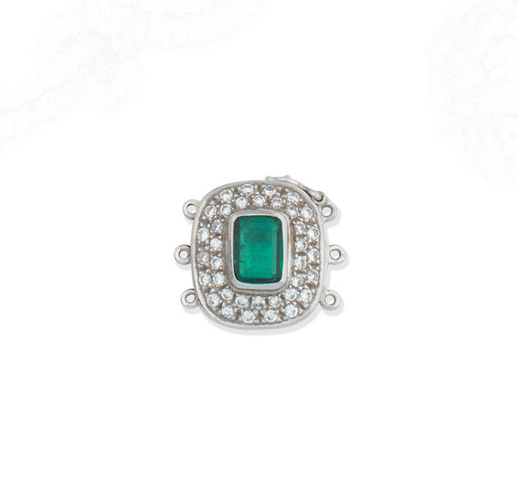 An emerald and diamond clasp