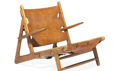 Børge Mogensen: “Hunting Chair”. A very rare and early lounge chair of solid, patinated oak. Seat and back with original patinated natural leather.