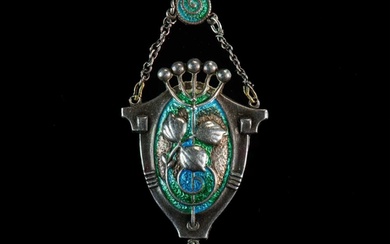 CHARLES HORNER: AN ARTS AND CRAFTS SILVER AND ENAMEL PENDANT...