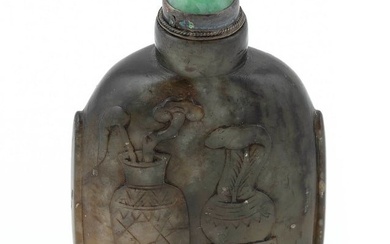 CHINESE CARVED HARDSTONE SNUFF BOTTLE Late 19th Century Height 2.75". Celadon jade stopper.