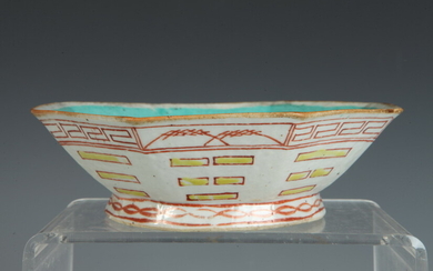 CHINESE OCTAGONAL CERAMIC BOWL. circa 1890. Red and yellow painted...