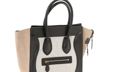 Céline: A “Luggage Tricolor PM” bag made of black leather, white canvas and grey suede, two short handles and one large compartment.