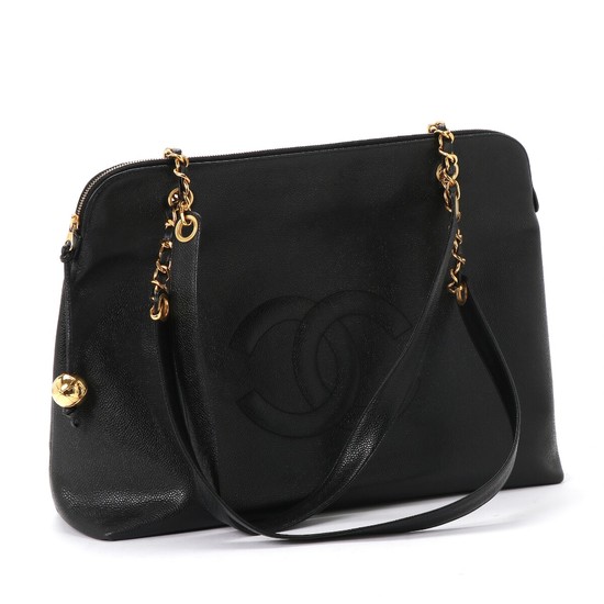 Chanel: A “Vintage Timeless Zip Tote” bag of black caviar calf leather, one big compartment, two zipped pockets and two handles. H. 32 x L. 43 x W .16 cm.