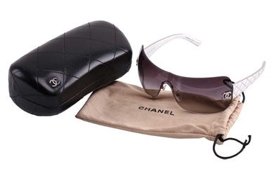 Chanel - a pair of rimless shield sunglasses with metallic silver diamond-quilted temples, construct