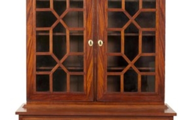 FEDERAL TWO-PART SECRETARY In mahogany and mahogany veneer. Upper portion with shaped cornice and two glazed doors enclosing three i...