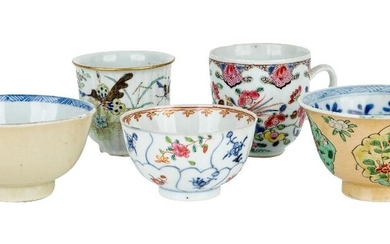 Four Chinese tea bowls and a coffee cup, Kangxi period and later, comprising two Kangxi tea bowls of creamy glaze, one painted in famille verte enamel with floral panels, the other two painted in famille rose enamels with birds and flowers. 6cm -...