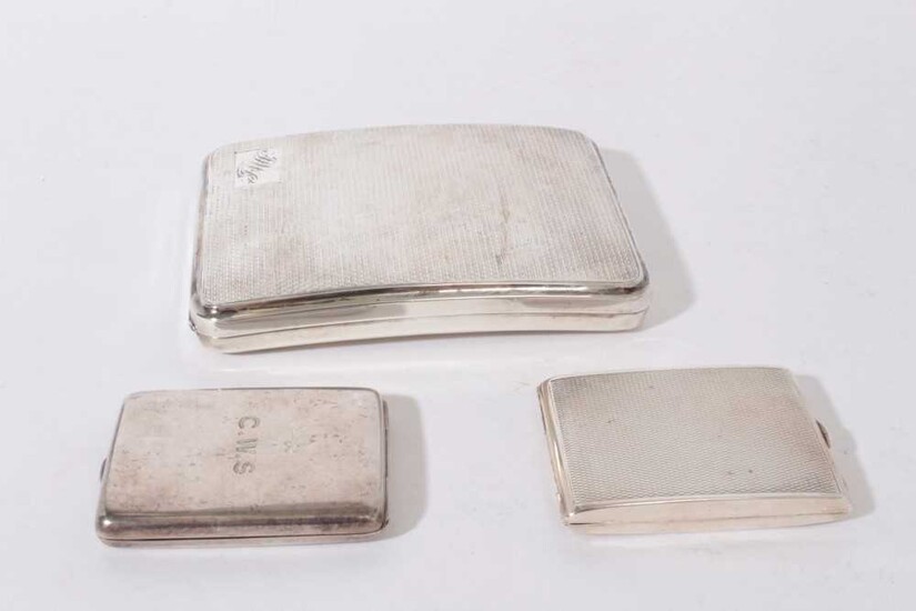 George V Silver Cigarette case of curved rectangular form with engine turned decoration (Birmingham 1929) together with two silver match book holders (various dates and makers), all at 7oz