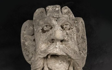 Grotesque male stone hat