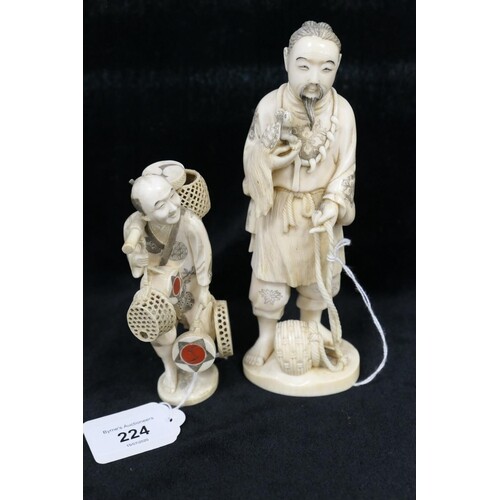 Japanese carved ivory okimono worked as a man with a pet ter...