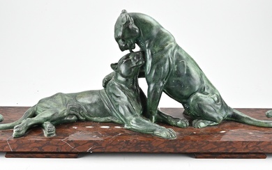 Large art deco figure. Circa 1920. Reclining panthers on red marble base. Dimensions: 35 x...