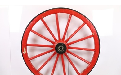 Large red painted spoked wooden & cast iron cart wheel, appr...