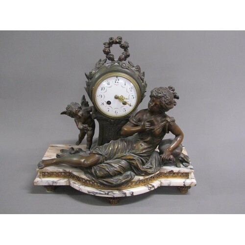 Late 19c French figural mantel clock depicting a reclining b...