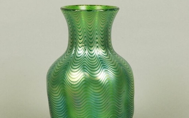 Loetz glassworks green glass vase of bulbous form, cased in a beautiful iridescent Candia Phanomen feathered finish. Circa 1890. Height 20 cm.