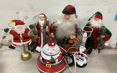 Lot of various christmas decorations(santa statues, lamp, kettle, and more) tallest 14.5in.