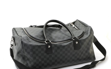 SOLD. Louis Vuitton: A "Roadster" travel bag made of grey and black Damier Graphite canvas...