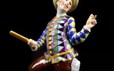 MEISSEN; a 19th century figure of a clown holding...