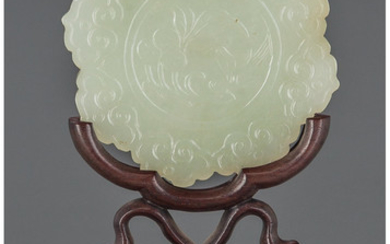 Maker unknown, A CHINESE CARVED PALE JADE BI DISK ON CARVED WOOD STAND