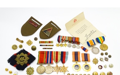 Militaria : a quantity of 20thC medals and insignia, compri...