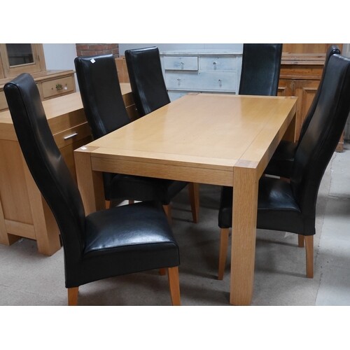 Modern light oak dining table and 6 faux leather chairs with...