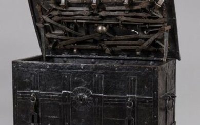 NUREMBERG CASE, also known as "CORSORIAL CASE" made of Nuremberg riveted iron plates, two hasps and a false lock entrance in the front, the flap reveals its complex internal bolt lock system. The interior hides a small safe. Wrought iron carrying...
