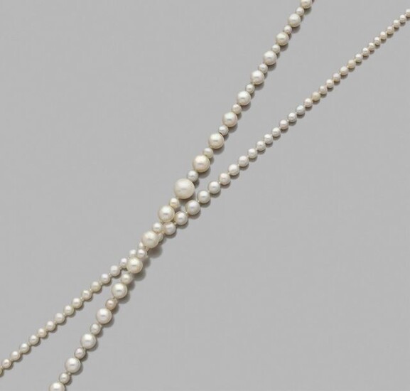 Necklace of fine and falling cultured pearls interspersed...