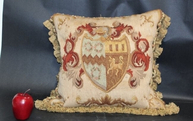 Needlepoint throw pillow with crest