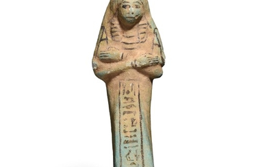OUSHABTI EN COSTUME DES VIVANTS Egypte, Troisième Période Intermédiaire, 1070-664 av. J.-C. Faïence siliceuse à...