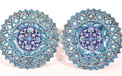 PAIR OF ISLAMIC BLUE PIERCED TIN GLAZED CHARGERS